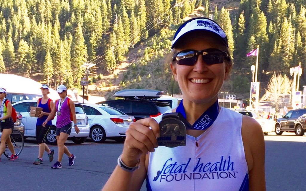 Kate Young shows off her half-ironman medal