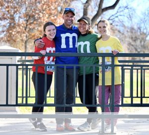 Lonnie, Michelle, Aspen, and Ashley pose as colordul M&Ms after The Great Candy Run fundraiser for Fetal Health Foundation