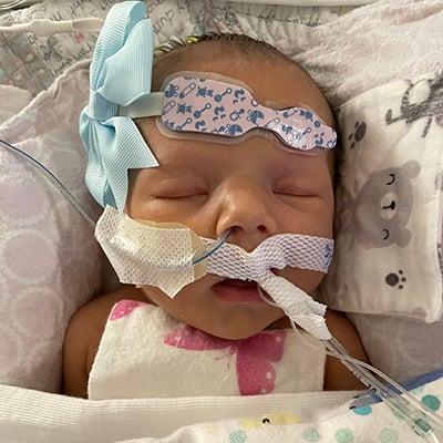 Evelyn as a newborn in the NICU awaiting her critically needed heart transplant